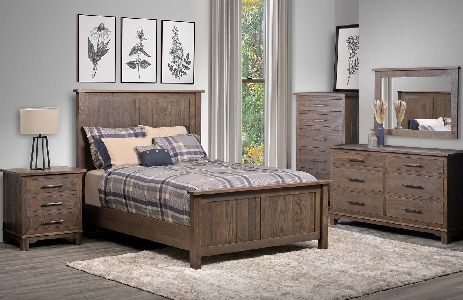 A plaid covered bed with a dusty brown wooden frame sits in a room with matching side table, dresser, and chest of drawers.
