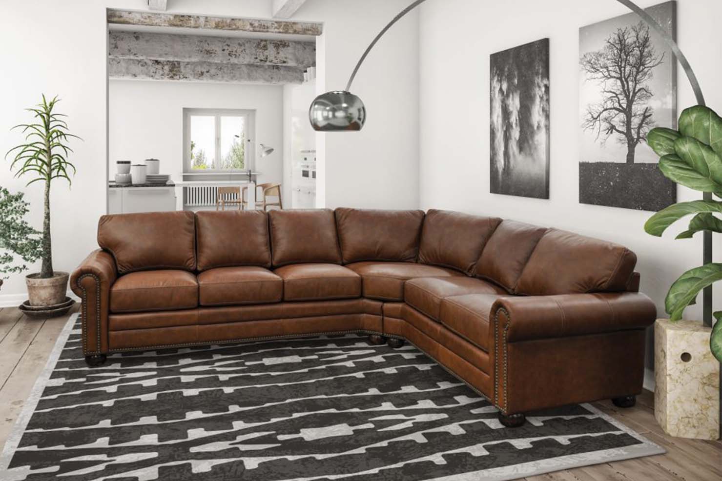 A warm brown leather sectional with plush cushions and rounded armrests sits on a geometric rug.
