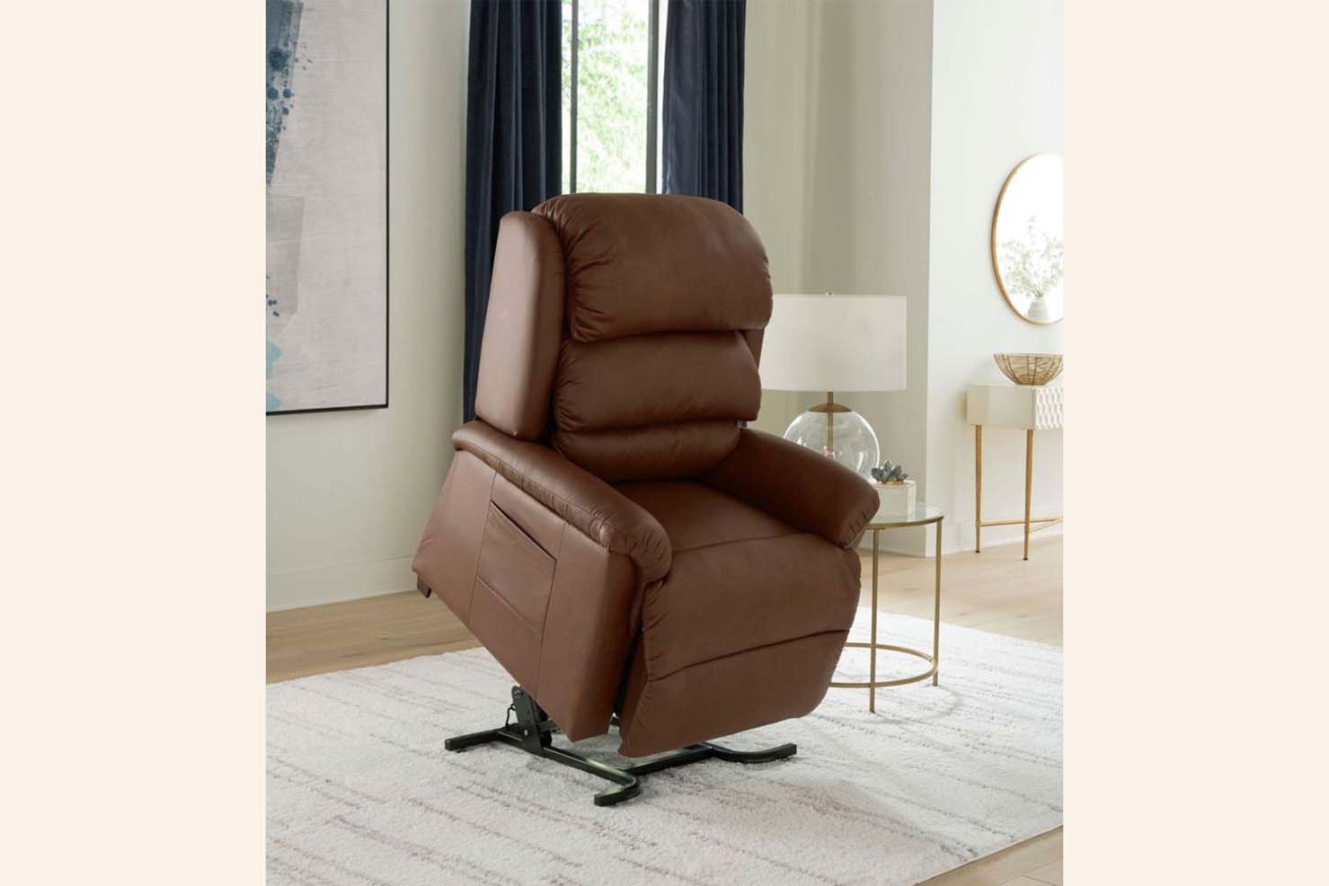 A photo of a brown leather power recliner displays it in an upright position,